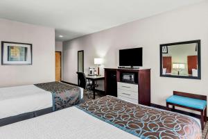 Postel nebo postele na pokoji v ubytování Best Western Plus - Magee Inn & Suites