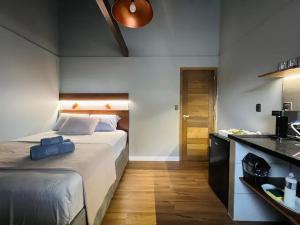 Postel nebo postele na pokoji v ubytování Loft 202 em frente à Vila Germânica Oktoberfest- Villa Haus