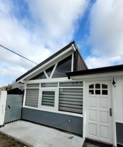 a white garage with a white garage door at Monoambiente El refugio in Río Grande