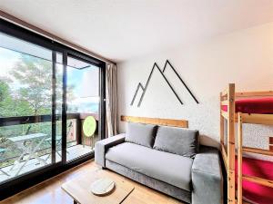 En eller flere senge i et værelse på Résidence Pegase - STUDIO 4 PERSONNES MAE-0631