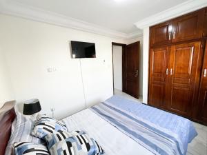 Ένα ή περισσότερα κρεβάτια σε δωμάτιο στο Studio Cosy centre AKWA