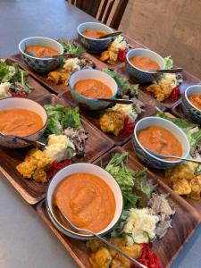 a table with bowls of dips and appetizers at Haryugetu Guesthouse in NASA in Kaiyo