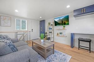 a living room with a couch and a table at Rucker Avenue Cozy Bungalow in Everett