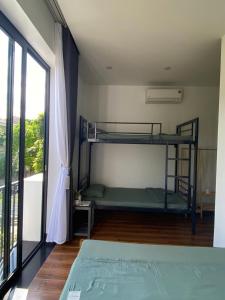 Postel nebo postele na pokoji v ubytování LavA homestay
