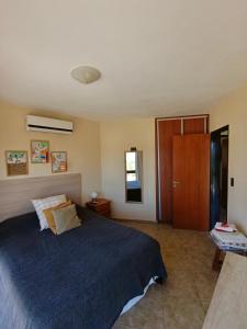 En eller flere senge i et værelse på Complejo Refugio Playa Perelli + 13 billeder