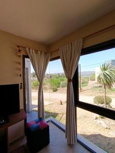 Et tv og/eller underholdning på Complejo Refugio Playa Perelli