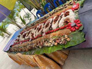 a sandwich with many different types of food on it at Chef Panyang Beach Resort Okoy in Ocoy