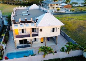 an aerial view of a house with a swimming pool at Happiness Home FiJi in Narewa