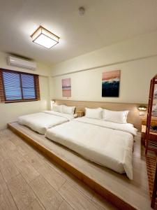 Letto o letti in una camera di 安平包棟Villa - 燈塔