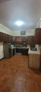 Kuchyň nebo kuchyňský kout v ubytování Casa Bugambilias