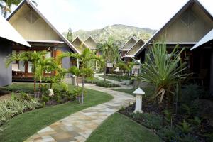 a resort with a garden and a walkway at Pure Magnetic Villa 10 in Nelly Bay