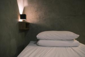 Letto o letti in una camera di G.O.A.T Hostel