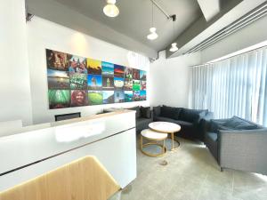 a living room with a couch and a table at SKY HOTEL Central Phnom Penh - Rooms & Apartments in Phnom Penh