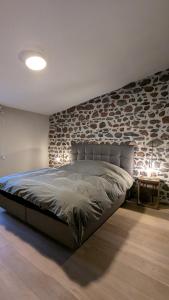 Postel nebo postele na pokoji v ubytování L'Etable - Le Hameau des Volcans, Maison de Vacances Luxe & Confort