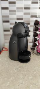 a black coffee maker sitting on a counter at Modern 3 bedroom with AC apartment in Żabbar +34 photos