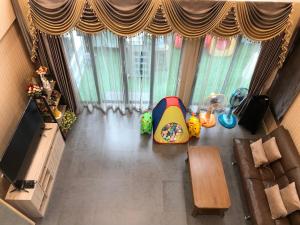 an overhead view of a living room with a television at My Own House SURAT THANI in Ban Huai Chiat