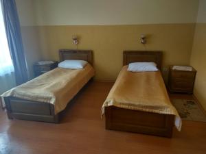 Postel nebo postele na pokoji v ubytování Hotel Smaragd