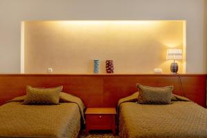 Postel nebo postele na pokoji v ubytování Pažaislis Park Hotel