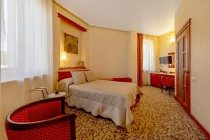 Postel nebo postele na pokoji v ubytování Pažaislis Park Hotel