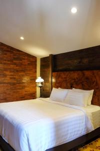 Un ou plusieurs lits dans un hébergement de l'établissement Bale Devata Resort