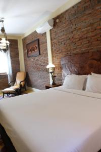 Un ou plusieurs lits dans un hébergement de l'établissement Bale Devata Resort