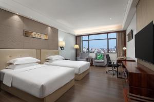 Postelja oz. postelje v sobi nastanitve Wyndham Garden Foshan Nanhai