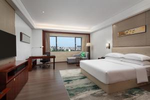 Postelja oz. postelje v sobi nastanitve Wyndham Garden Foshan Nanhai