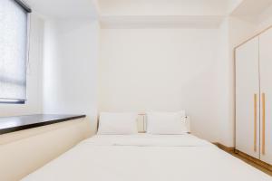 Ένα ή περισσότερα κρεβάτια σε δωμάτιο στο Modern Look Studio Room Collins Boulevard Apartment By Travelio +8 φωτογραφίες