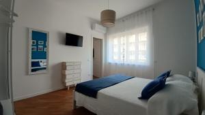 A bed or beds in a room at Al Duca appartamento in centro