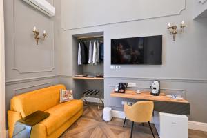 TV a/nebo společenská místnost v ubytování Toledo 424 Suite