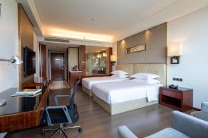 Postelja oz. postelje v sobi nastanitve Wyndham Garden Foshan Nanhai