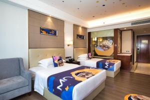Postelja oz. postelje v sobi nastanitve Wyndham Garden Foshan Nanhai