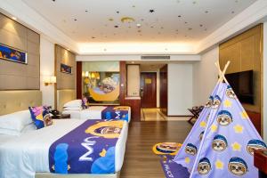 Postelja oz. postelje v sobi nastanitve Wyndham Garden Foshan Nanhai