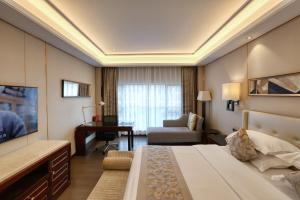 Postelja oz. postelje v sobi nastanitve Wyndham Garden Foshan Nanhai