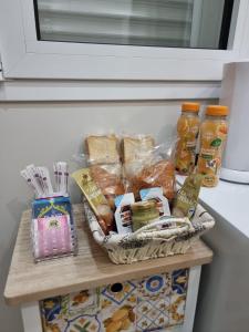 a basket of food on a shelf in a refrigerator at La Trinacria casa vacanze in Bronte +6 photos