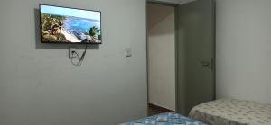 a room with a flat screen tv on the wall at Tu lugar de Descanso II in Federación