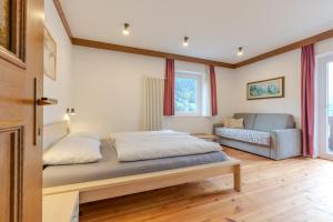 Postel nebo postele na pokoji v ubytování Haus Vieider