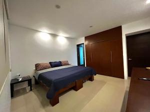 Ένα ή περισσότερα κρεβάτια σε δωμάτιο στο Departamento Deluxe +27 φωτογραφίες