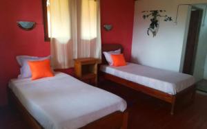 Ένα ή περισσότερα κρεβάτια σε δωμάτιο στο GO Andasibe Hotel
