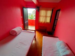 Postel nebo postele na pokoji v ubytování Bindabasini Home NO-9