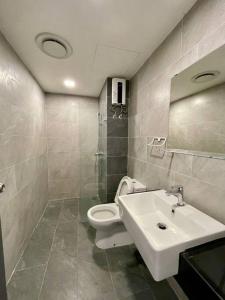 a bathroom with a sink and a toilet at Emporis8 Netflix at SEGI Emhub Kota Damansara IKEA in Petaling Jaya