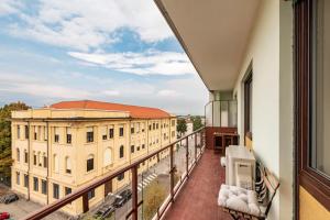 an apartment balcony with a view of a building at Happy Venaria by Rentbeat in Venaria Reale