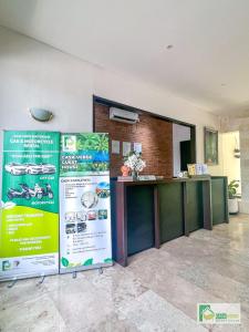 a reception area of a building with a counter at Casa Verde Guest House in Sempidi +51 photos