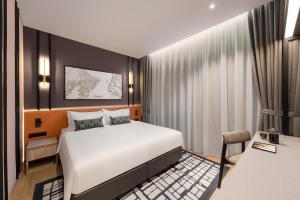 Postel nebo postele na pokoji v ubytování Citadines Connect Cecil Georgetown Penang