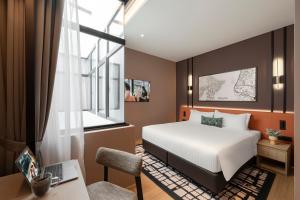 Postel nebo postele na pokoji v ubytování Citadines Connect Cecil Georgetown Penang