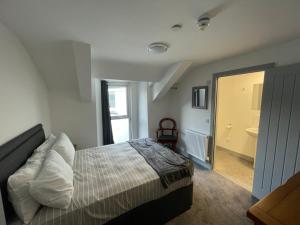 Postel nebo postele na pokoji v ubytování Abergwaun Cottage