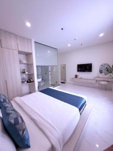 Ένα ή περισσότερα κρεβάτια σε δωμάτιο στο The Luxury