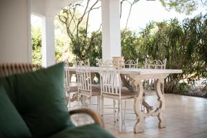 a white table and chairs on a porch at Villa Maria in Villanova di Ostuni +33 photos