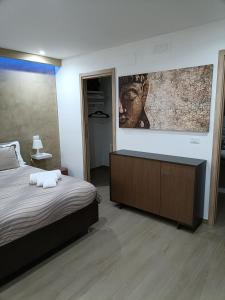 Ένα ή περισσότερα κρεβάτια σε δωμάτιο στο Blueroom ASSO