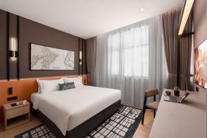 Postel nebo postele na pokoji v ubytování Citadines Connect Cecil Georgetown Penang